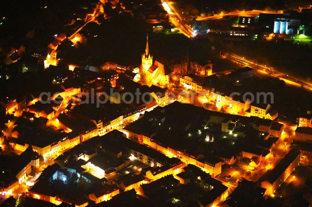 Bad Freienwalde (Oder) at night from above - Night lighting The city center in the downtown area on Evangelischen Stadtpfarrkirche St. Nikolai in Bad Freienwalde (Oder) in the state Brandenburg, Germany