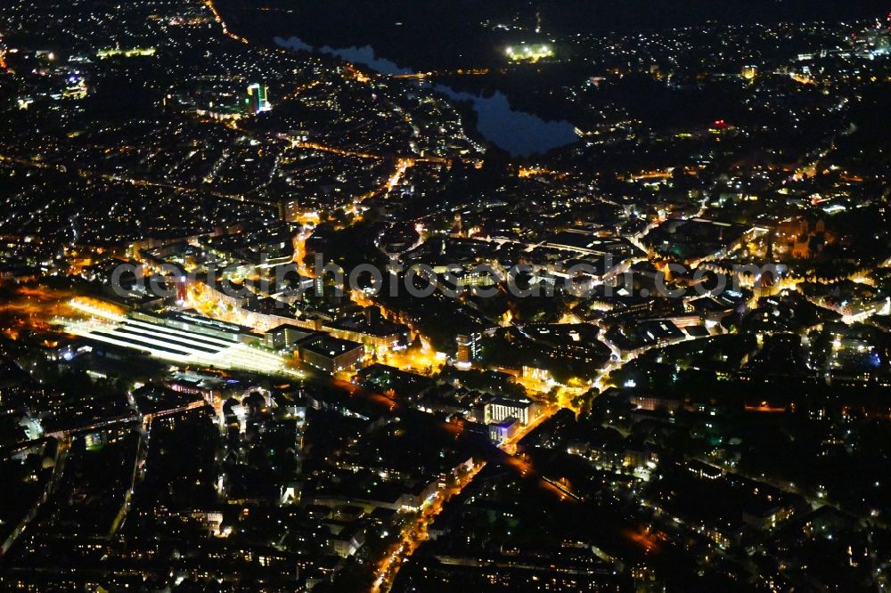 Münster at night from the bird perspective: Night lighting The city center in the downtown area on Central Station in Muenster in the state North Rhine-Westphalia, Germany