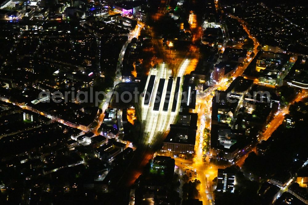 Münster at night from the bird perspective: Night lighting The city center in the downtown area on Central Station in Muenster in the state North Rhine-Westphalia, Germany