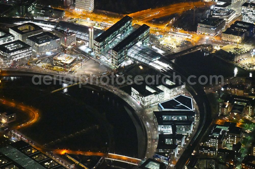 Aerial image at night Berlin - Night lighting City center in the downtown area on the banks of river course of Spree River in the district Tiergarten in Berlin, Germany