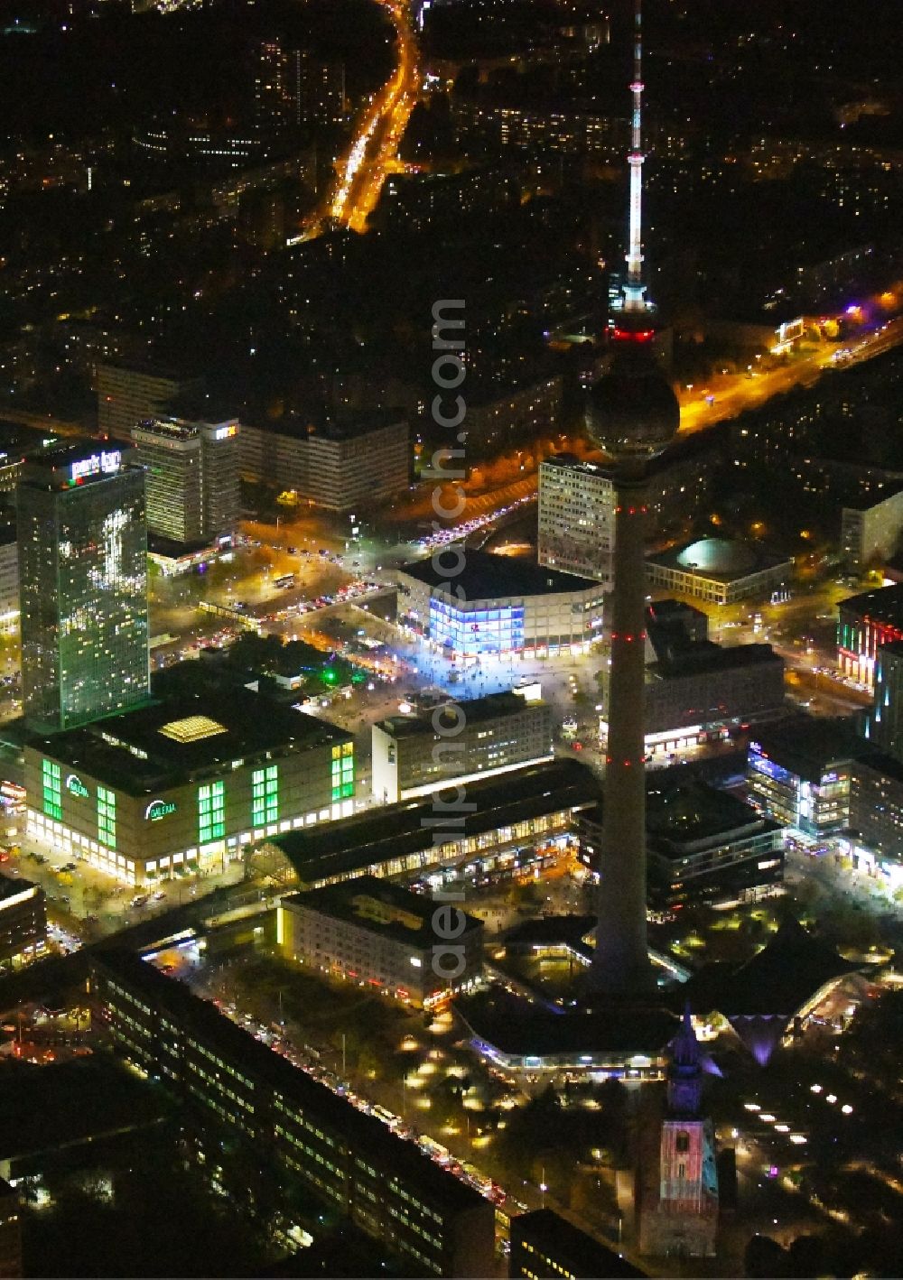 Aerial photograph at night Berlin - Night lighting The city center in the downtown area Ost on Berliner Fernsehturm - Alexanderstrasse - Rathausstrasse in the district Mitte in Berlin, Germany