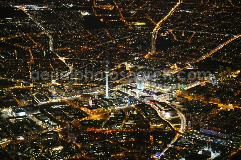 Berlin at night from above - Night lighting The city center in the downtown area Ost on Berliner Fernsehturm - Alexanderstrasse - Rathausstrasse - Unter den Linden in the district Mitte in Berlin, Germany