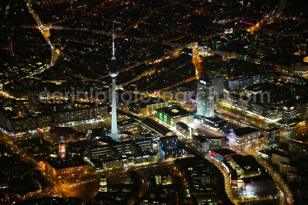 Aerial photograph at night Berlin - Night lighting The city center in the downtown area Ost on Berliner Fernsehturm - Alexanderstrasse - Rathausstrasse - Unter den Linden in the district Mitte in Berlin, Germany