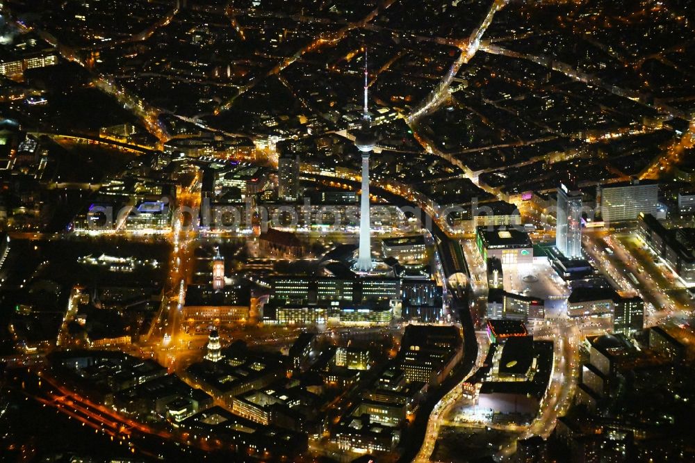 Aerial image at night Berlin - Night lighting The city center in the downtown area Ost on Berliner Fernsehturm - Alexanderstrasse - Rathausstrasse - Unter den Linden in the district Mitte in Berlin, Germany