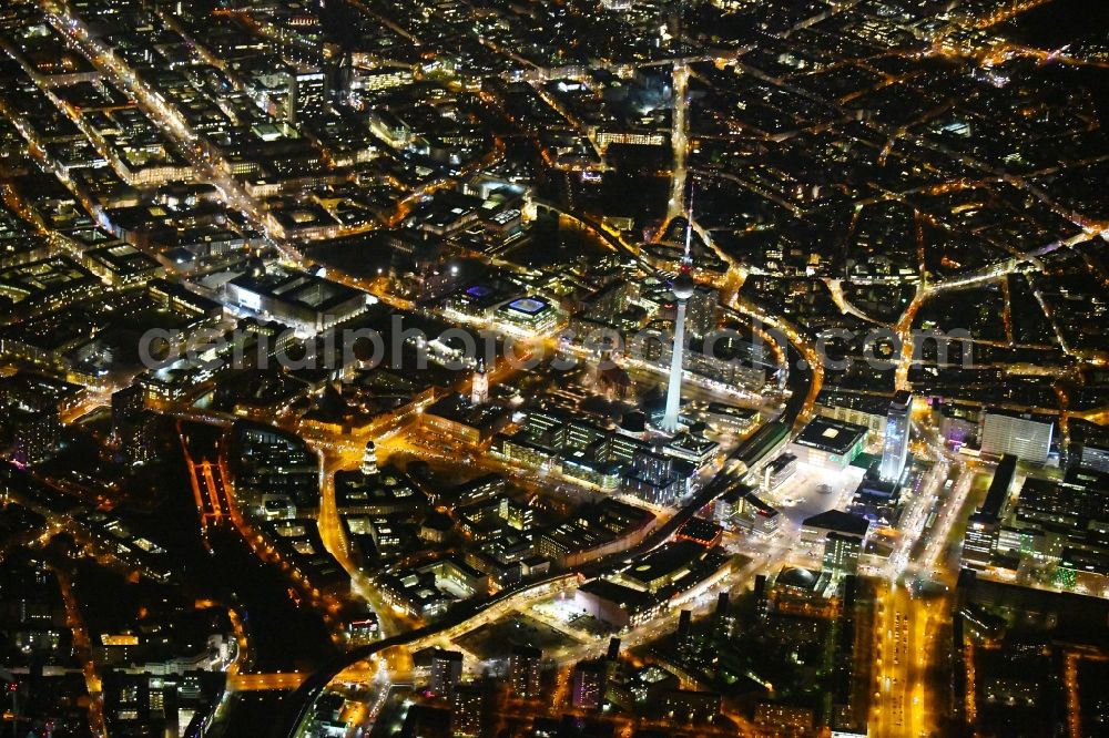 Berlin at night from above - Night lighting The city center in the downtown area Ost on Berliner Fernsehturm - Alexanderstrasse - Rathausstrasse - Unter den Linden in the district Mitte in Berlin, Germany