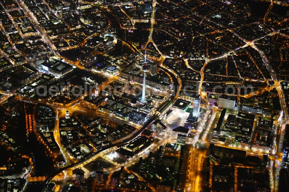 Berlin at night from the bird perspective: Night lighting The city center in the downtown area Ost on Berliner Fernsehturm - Alexanderstrasse - Rathausstrasse - Unter den Linden in the district Mitte in Berlin, Germany