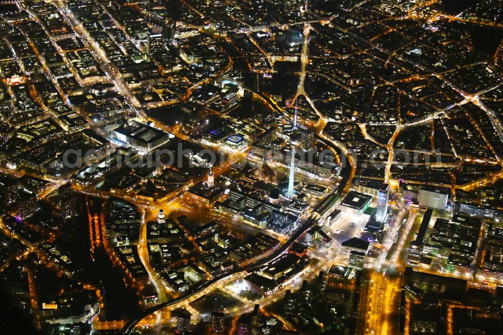 Berlin at night from above - Night lighting The city center in the downtown area Ost on Berliner Fernsehturm - Alexanderstrasse - Rathausstrasse - Unter den Linden in the district Mitte in Berlin, Germany