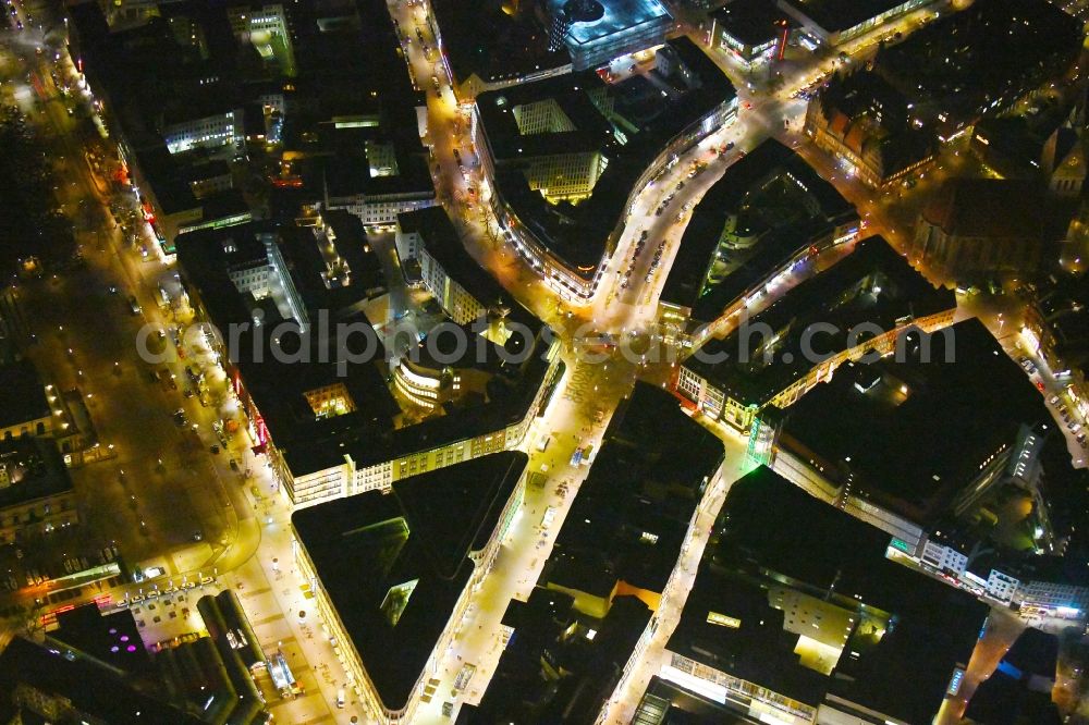 Hannover at night from the bird perspective: Night lighting The city center in the downtown area Georgstrasse - Bahnhofstrasse - Rathenaustrasse - Karmarschstrasse - Osterstrasse in Hannover in the state Lower Saxony, Germany