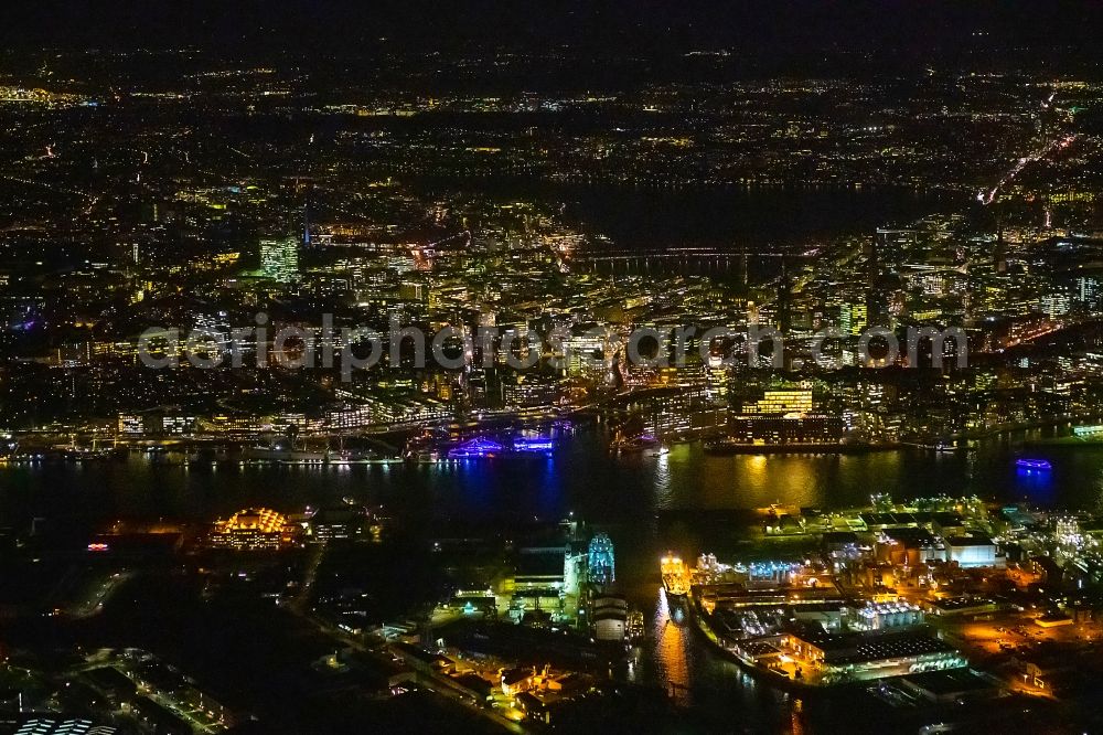 Aerial image at night Hamburg - Night lighting city center in the downtown area on the banks of river course of the River Elbe in Hamburg, Germany