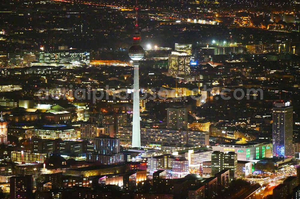 Aerial photograph at night Berlin - Night lighting The city center in the downtown area between Rathausstrasse - TV tower and place Alexanderplatz in the district Mitte in Berlin, Germany