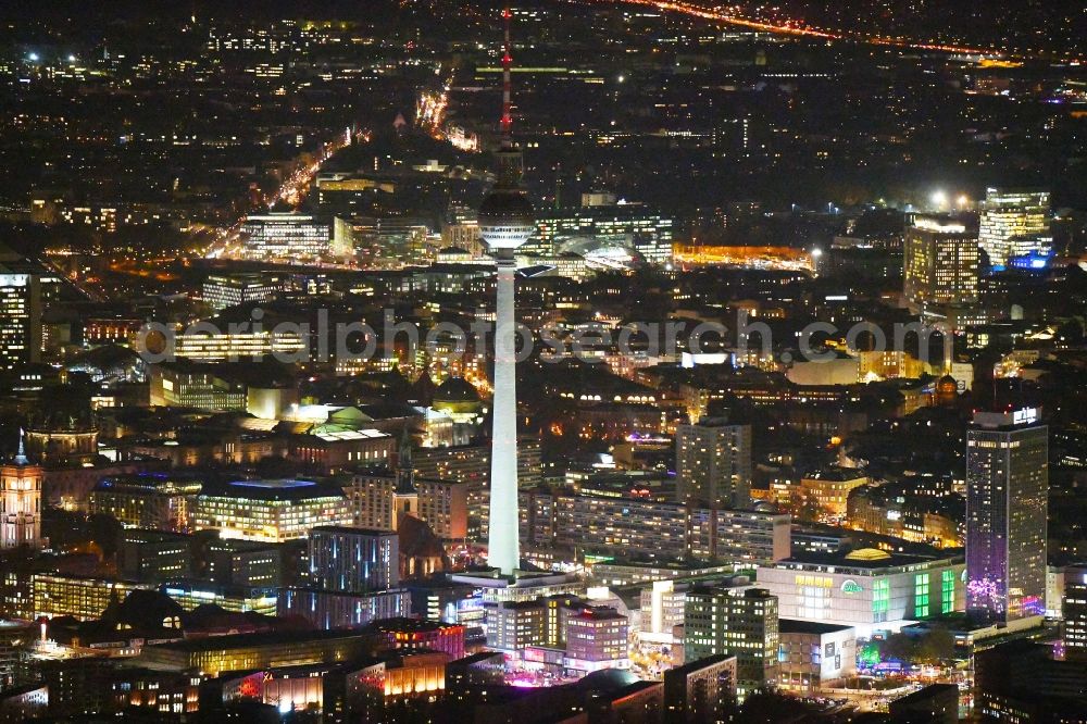 Aerial photograph at night Berlin - Night lighting The city center in the downtown area between Rathausstrasse - TV tower and place Alexanderplatz in the district Mitte in Berlin, Germany