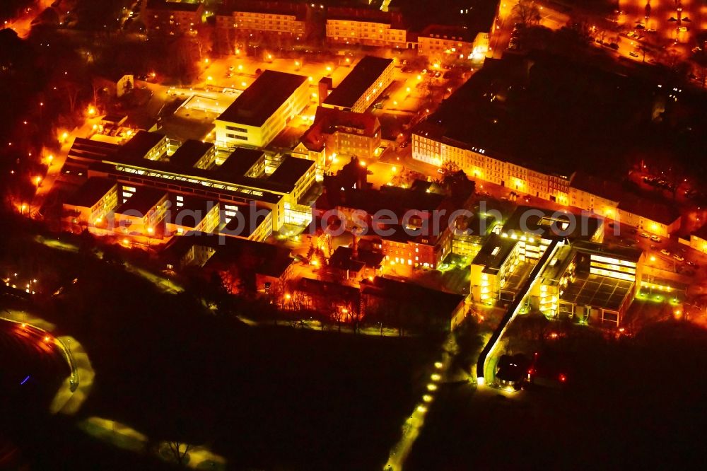 Brandenburg an der Havel at night from the bird perspective: Night lighting clinic area with the new building and the old building of the hospital of the Urban medical centre Brandenburg GmbH overlooking the vineyard and the Friedenswarte auf dem Marienberg in Brandenburg to Havel in the federal state Brandenburg, Germany