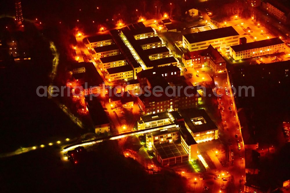 Brandenburg an der Havel at night from above - Night lighting clinic area with the new building and the old building of the hospital of the Urban medical centre Brandenburg GmbH overlooking the vineyard and the Friedenswarte auf dem Marienberg in Brandenburg to Havel in the federal state Brandenburg, Germany