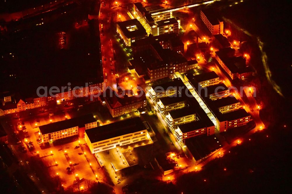 Brandenburg an der Havel at night from above - Night lighting clinic area with the new building and the old building of the hospital of the Urban medical centre Brandenburg GmbH overlooking the vineyard and the Friedenswarte auf dem Marienberg in Brandenburg to Havel in the federal state Brandenburg, Germany