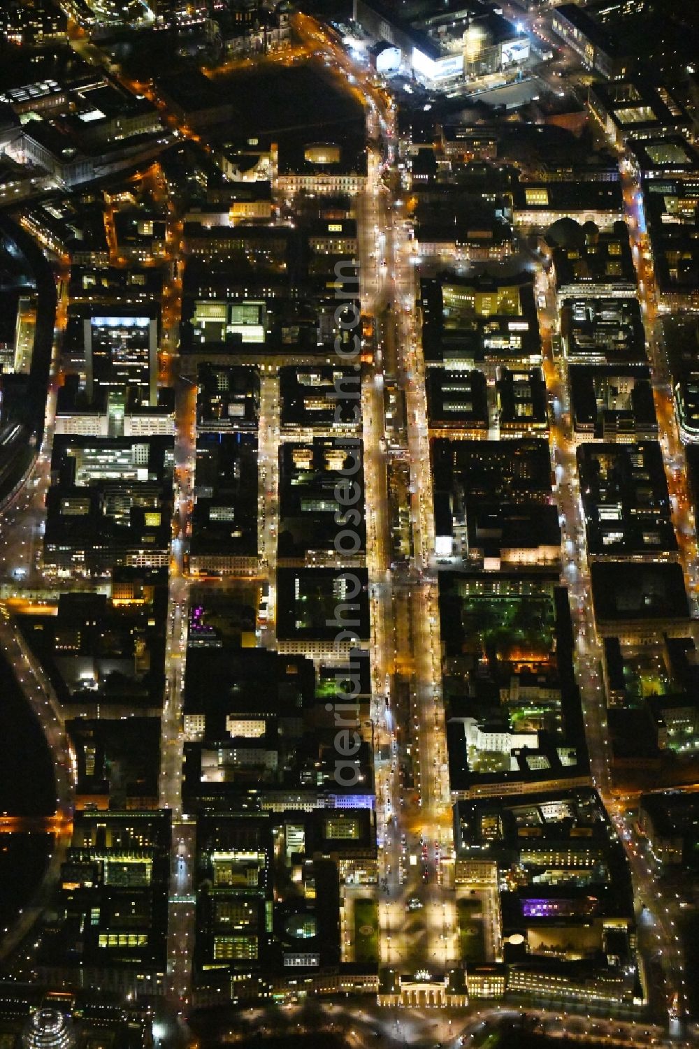 Aerial image at night Berlin - Night lighting Street guide of famous promenade and shopping street Brandenburger Tor - Pariser Platz - Unter den Linden in the district Mitte in Berlin, Germany