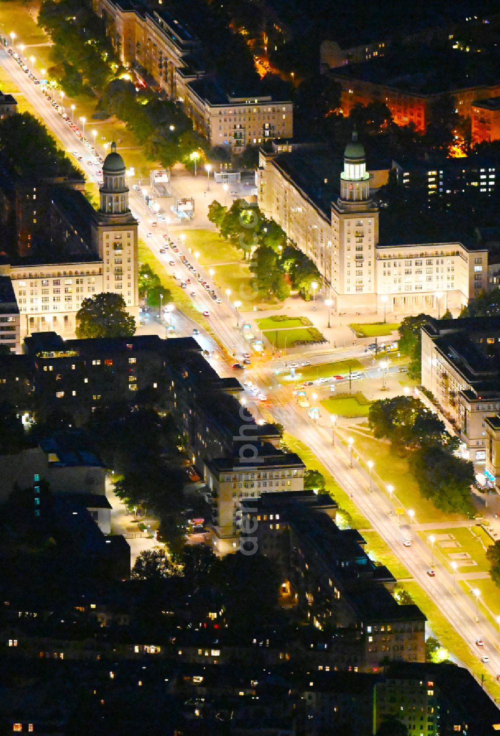 Aerial image at night Berlin - Night view of street guide of famous promenade and shopping street Frankfurter Allee - place Frankfurter Tor and formerly cinema building KOSMOS destrict Friedrichshain in Berlin