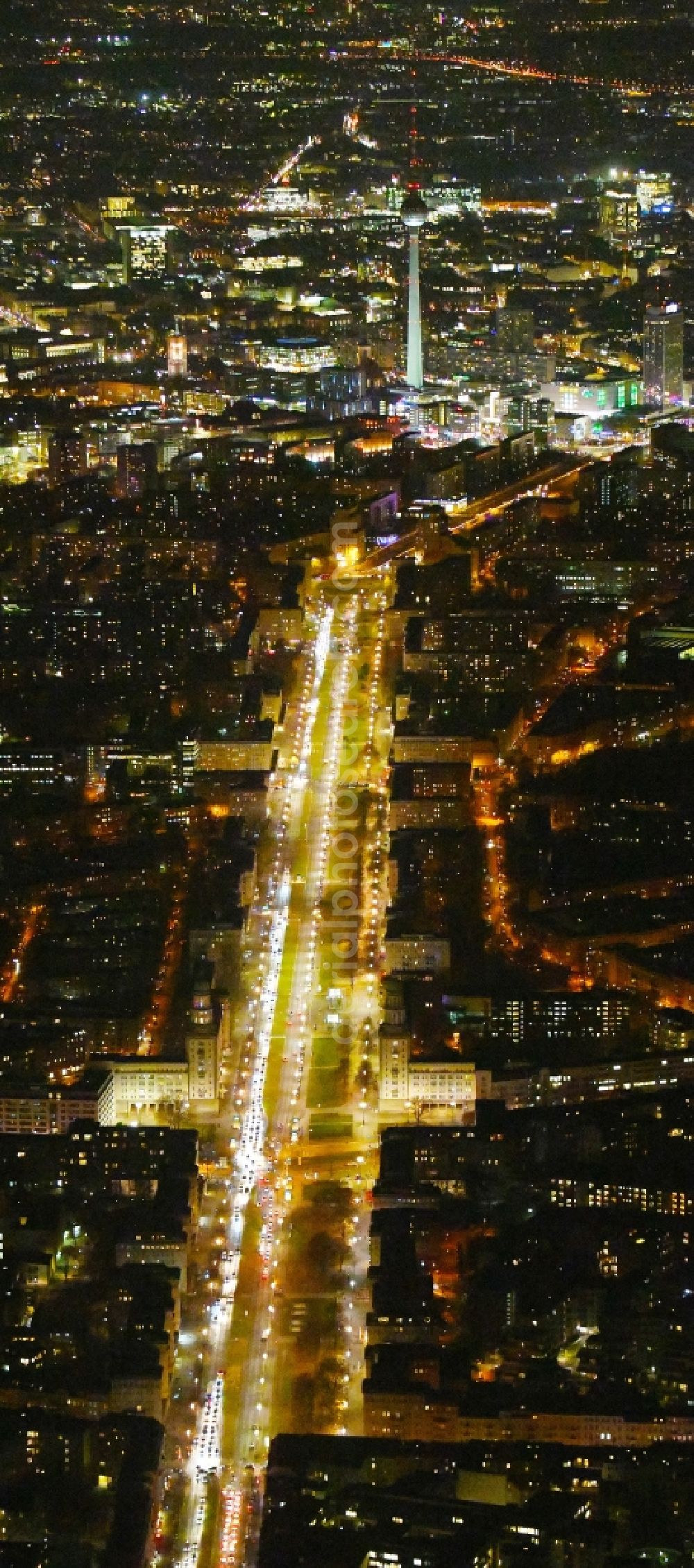 Aerial photograph at night Berlin - Night lighting Street guide of famous promenade and shopping street Karl-Marx-Allee Frankfurter Tor - Frankfurter Allee in the district Friedrichshain in Berlin, Germany