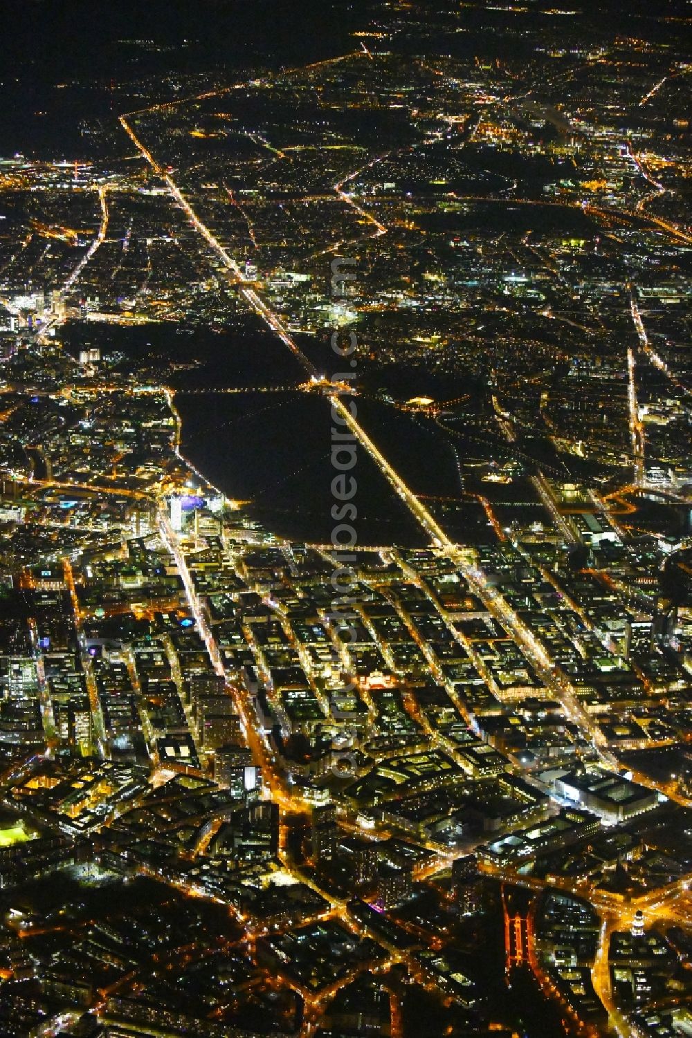 Aerial image at night Berlin - Night lighting Street guide of famous promenade and shopping street Leipziger Strasse - Friedrichstrasse - Unter den Linden - Str. of 17.Juni in the district Mitte in Berlin, Germany