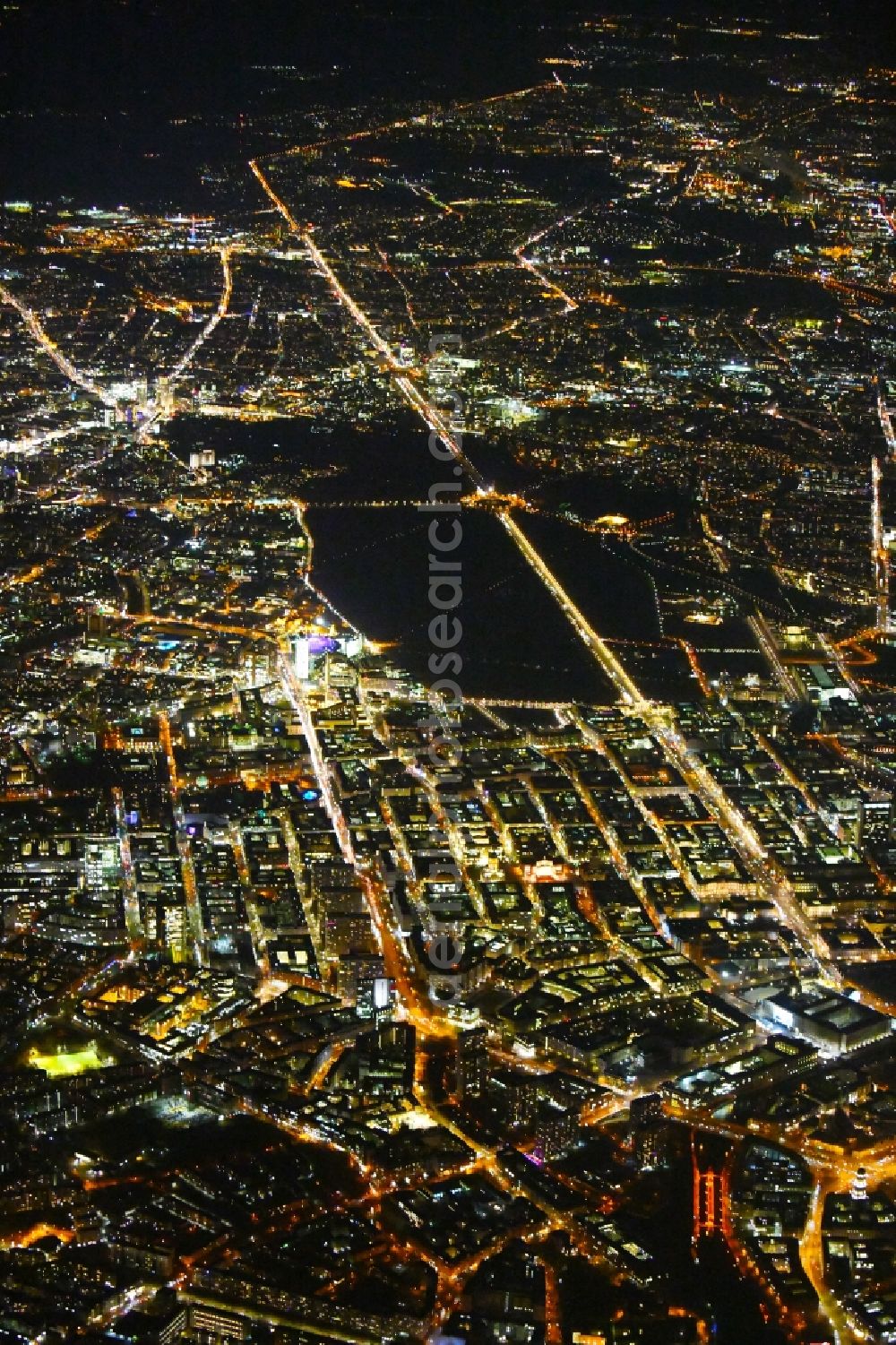 Berlin at night from above - Night lighting Street guide of famous promenade and shopping street Leipziger Strasse - Friedrichstrasse - Unter den Linden - Str. of 17.Juni in the district Mitte in Berlin, Germany