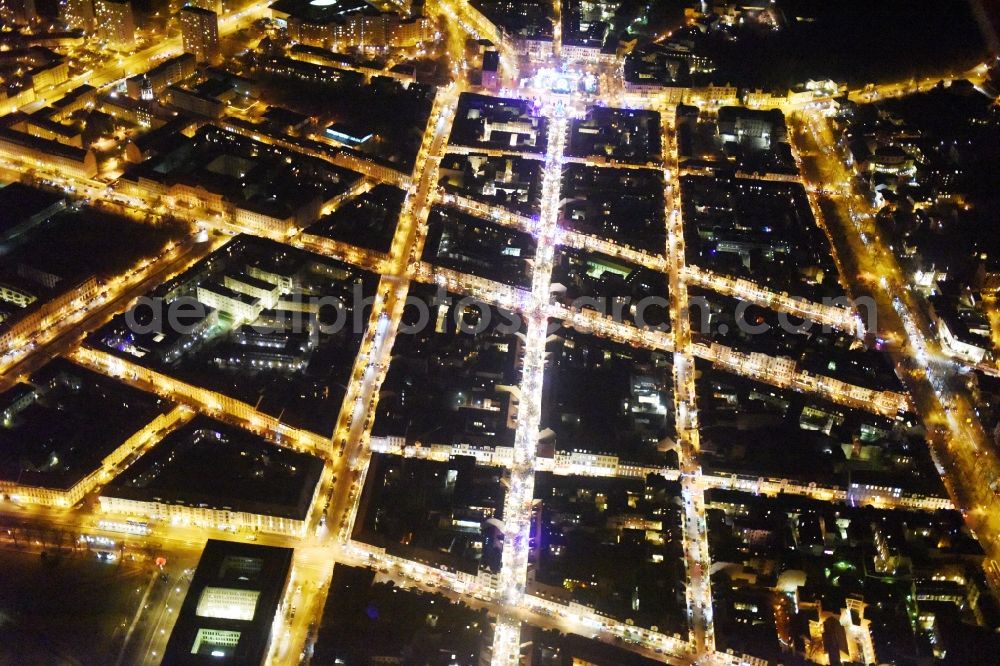 Potsdam at night from the bird perspective: Night view street guide of famous promenade and shopping street Luisenplatz - Brandenburger Strasse - Am Bassinplatz in Potsdam in the state Brandenburg