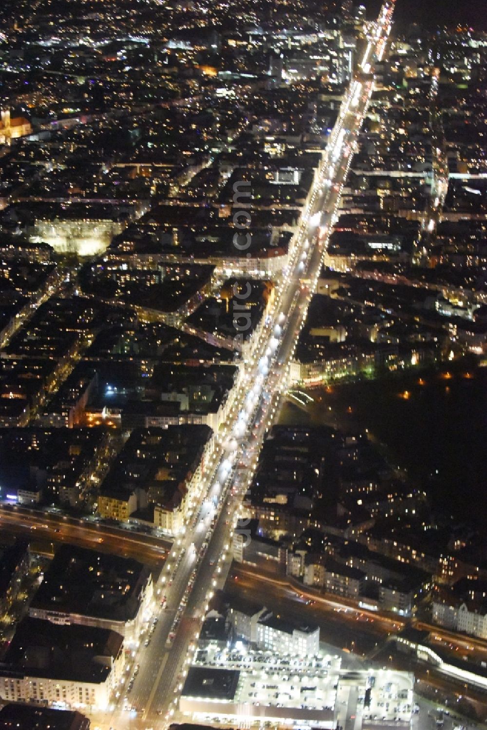 Aerial image at night Berlin - Night view street guide of famous promenade and shopping street Theodor-Heuss-Platz - Kaiserdamm-Masurenallee in Berlin