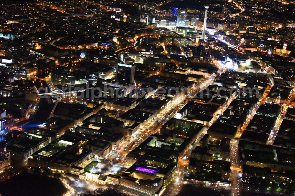 Aerial image at night Berlin - Street guide of famous promenade and shopping street Unter den Linden with place Pariser Platz and gate Brandenburger Tor in Berlin