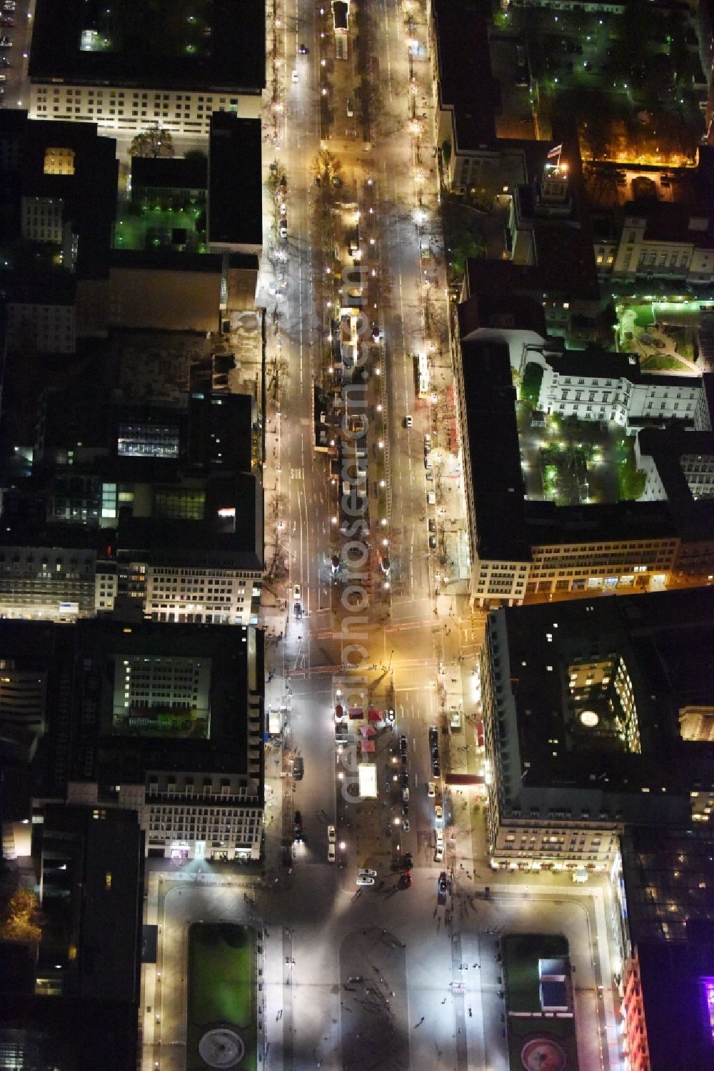 Berlin at night from the bird perspective: Street guide of famous promenade and shopping street Unter den Linden with place Pariser Platz and gate Brandenburger Tor in Berlin