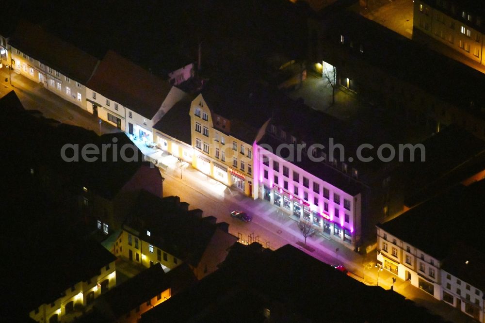 Aerial image at night Strausberg - Night lighting Street guide of promenade and shopping street Grosse Strasse in Strausberg in the state Brandenburg, Germany