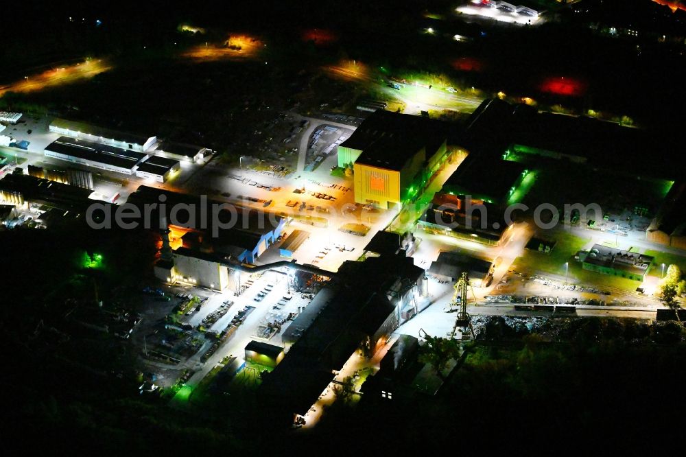 Aerial image at night Bous - Night lighting technical equipment and production facilities of the steelworks on Saarstrasse in Bous in the state Saarland, Germany