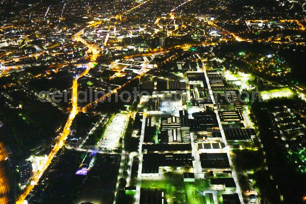 Aerial image at night Osnabrück - Night lighting Technical equipment and production facilities of the steelworks of KME Germany GmbH & Co. KG on Klosterstrasse in Osnabrueck in the state Lower Saxony, Germany