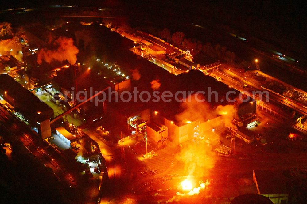 Völklingen at night from above - Night lighting technical equipment and production facilities of the steelworks Saarstahl LD in Voelklingen in the state Saarland, Germany