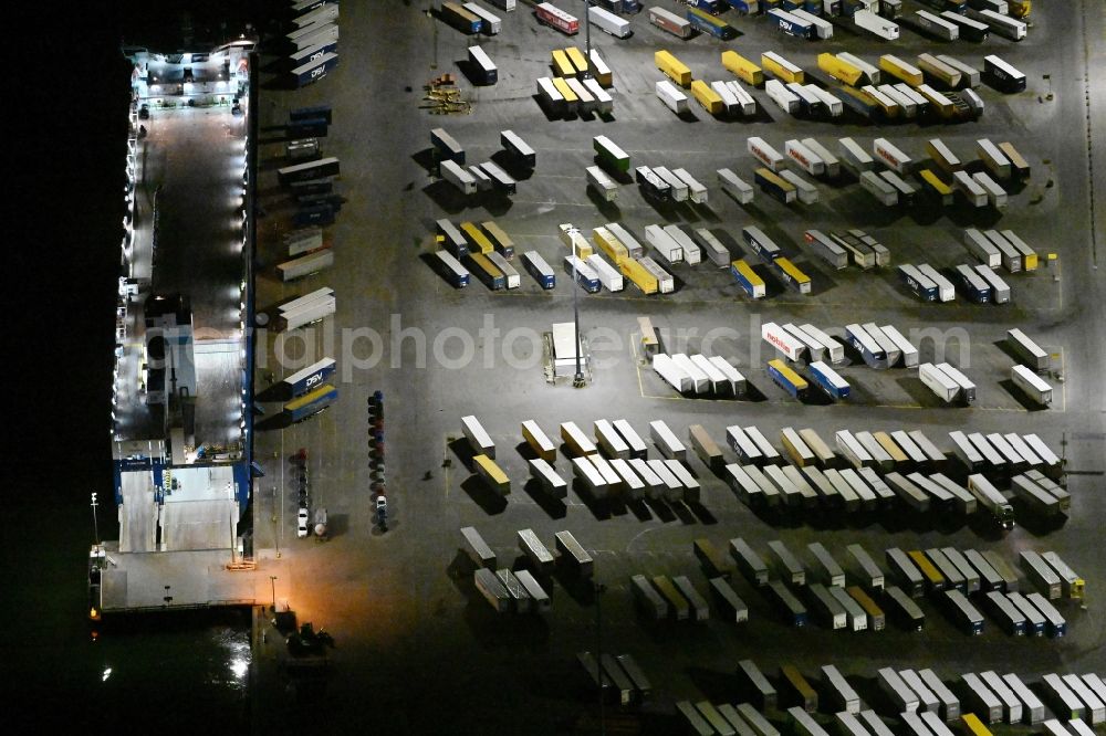 Travemünde at night from above - Night lighting building complex and distribution center on the site of Terminal Skandinavienkai in the district Ivendorf in Travemuende in the state Schleswig-Holstein, Germany