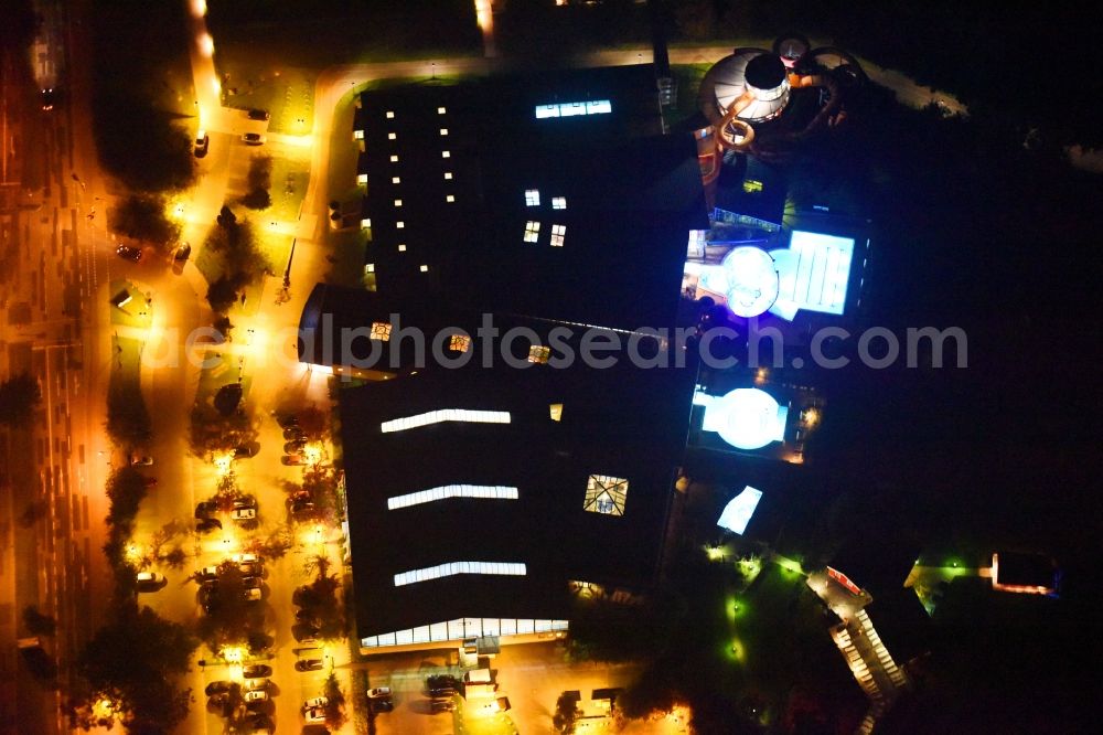 Wismar at night from above - Night lighting Spa and swimming pools at the swimming pool of the leisure facility of InterSPA Gesellschaft fuer Betrieb WONNEMAR Wismar mbH in Wismar in the state Mecklenburg - Western Pomerania, Germany