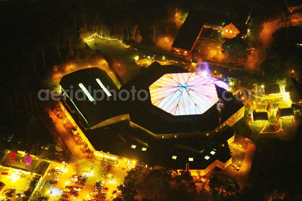 Ludwigsfelde at night from above - Night lighting Spa and swimming pools at the swimming pool of the leisure facility of Kristall Baeof AG in Ludwigsfelde in the state Brandenburg, Germany