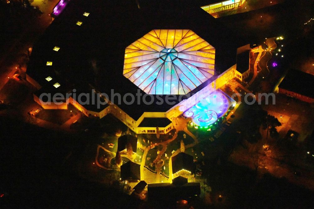 Ludwigsfelde at night from above - Night lighting Spa and swimming pools at the swimming pool of the leisure facility of Kristall Baeof AG in Ludwigsfelde in the state Brandenburg, Germany