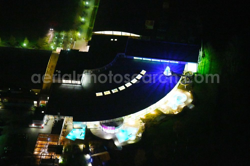 Oranienburg at night from above - Night lighting Spa and swimming pools at the swimming pool of the leisure facility TURM ErlebnisCity on Andre-Picon-Strasse in Oranienburg in the state Brandenburg, Germany