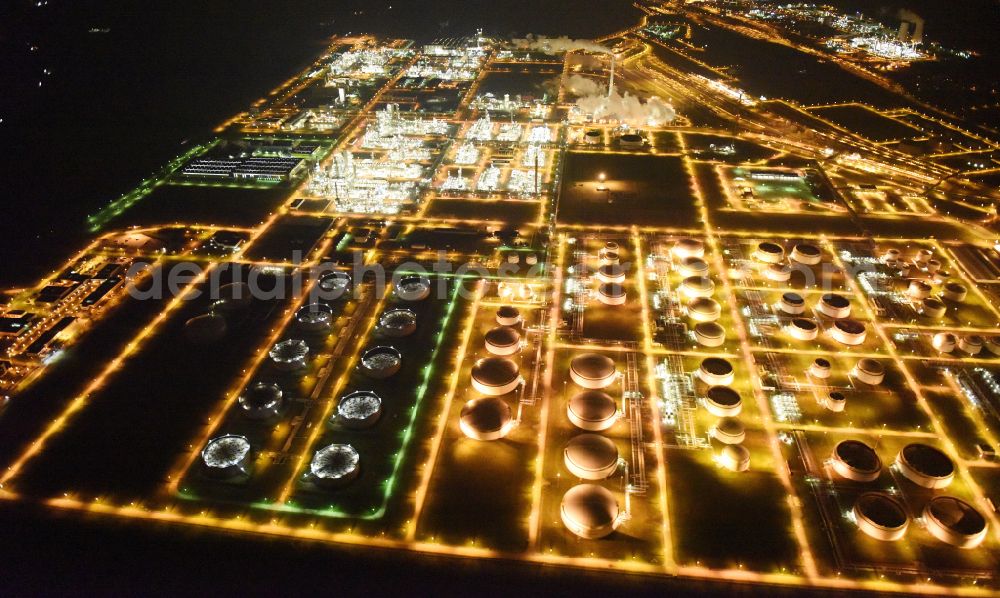 Aerial photograph at night Leuna - Night lighting tOTAL refinery in central Germany in Leuna in the federal state of Saxony-Anhalt. The TOTAL refinery chemical site Leuna is one of the most modern refineries in Europe