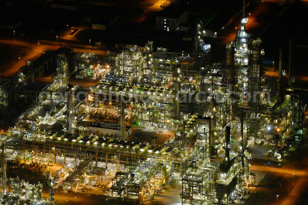 Leuna at night from above - Night lighting tOTAL refinery in central Germany in Leuna in the federal state of Saxony-Anhalt. The TOTAL refinery chemical site Leuna is one of the most modern refineries in Europe