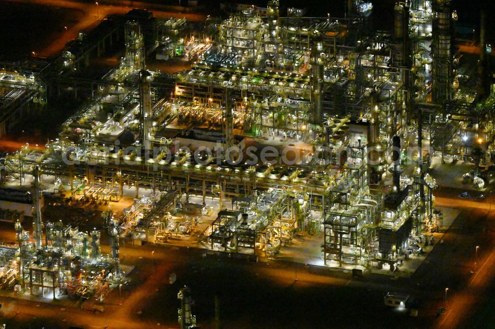 Leuna at night from the bird perspective: Night lighting tOTAL refinery in central Germany in Leuna in the federal state of Saxony-Anhalt. The TOTAL refinery chemical site Leuna is one of the most modern refineries in Europe