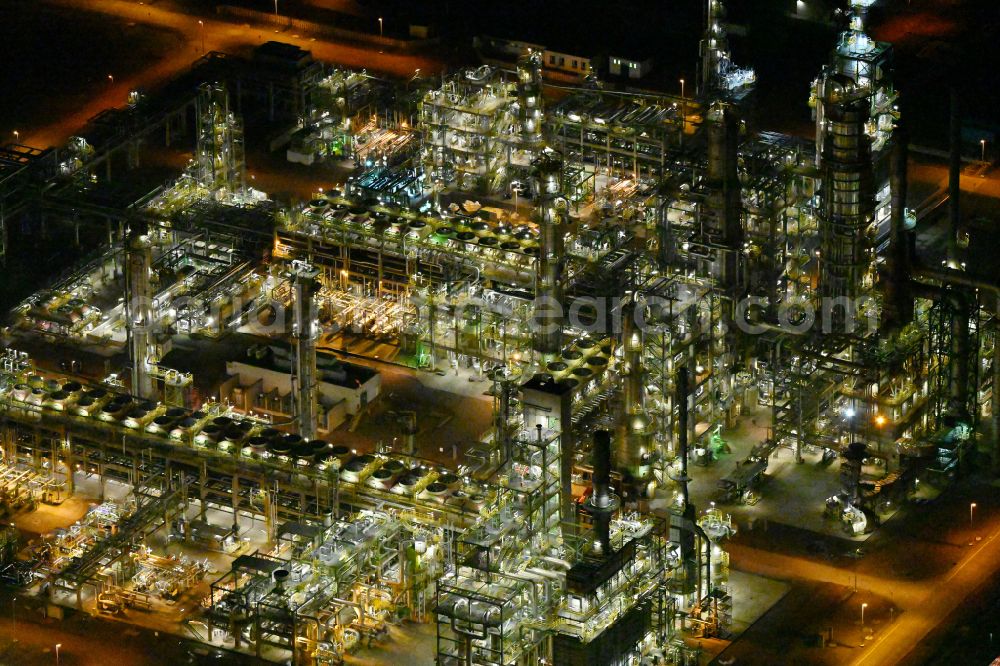 Aerial image at night Leuna - Night lighting tOTAL refinery in central Germany in Leuna in the federal state of Saxony-Anhalt. The TOTAL refinery chemical site Leuna is one of the most modern refineries in Europe