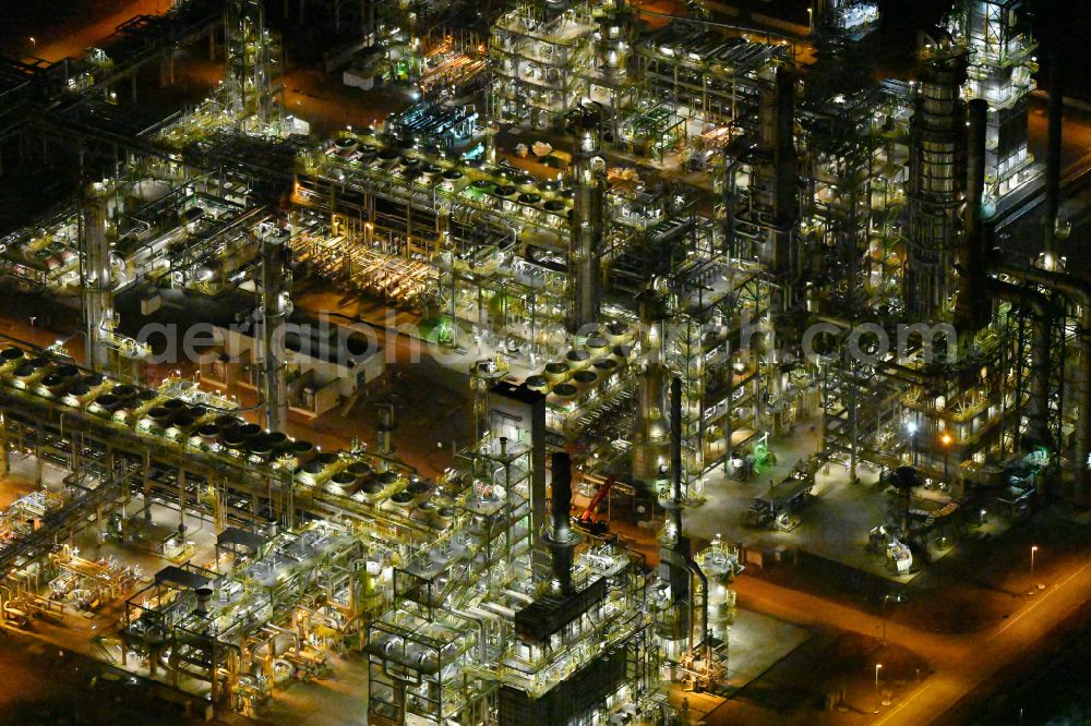 Leuna at night from above - Night lighting tOTAL refinery in central Germany in Leuna in the federal state of Saxony-Anhalt. The TOTAL refinery chemical site Leuna is one of the most modern refineries in Europe