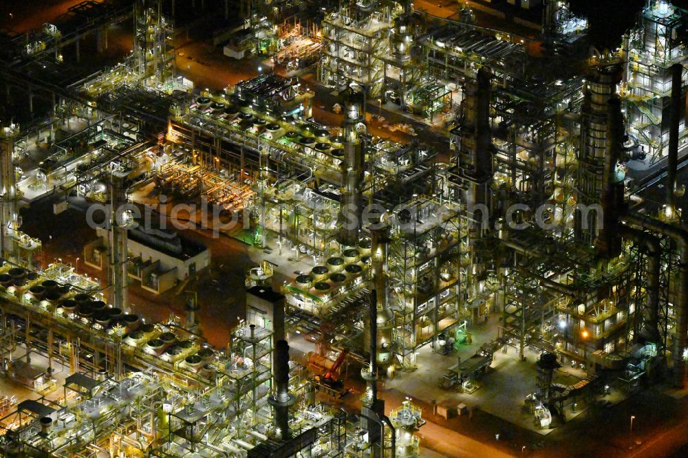 Leuna at night from the bird perspective: Night lighting tOTAL refinery in central Germany in Leuna in the federal state of Saxony-Anhalt. The TOTAL refinery chemical site Leuna is one of the most modern refineries in Europe