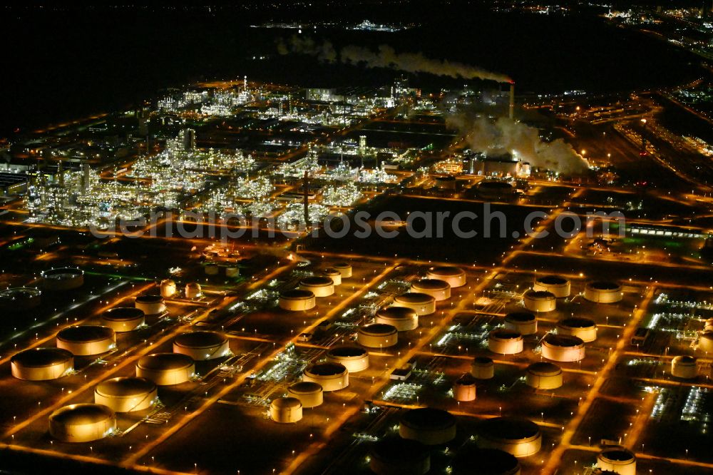 Leuna at night from the bird perspective: Night lighting tOTAL refinery in central Germany in Leuna in the federal state of Saxony-Anhalt. The TOTAL refinery chemical site Leuna is one of the most modern refineries in Europe