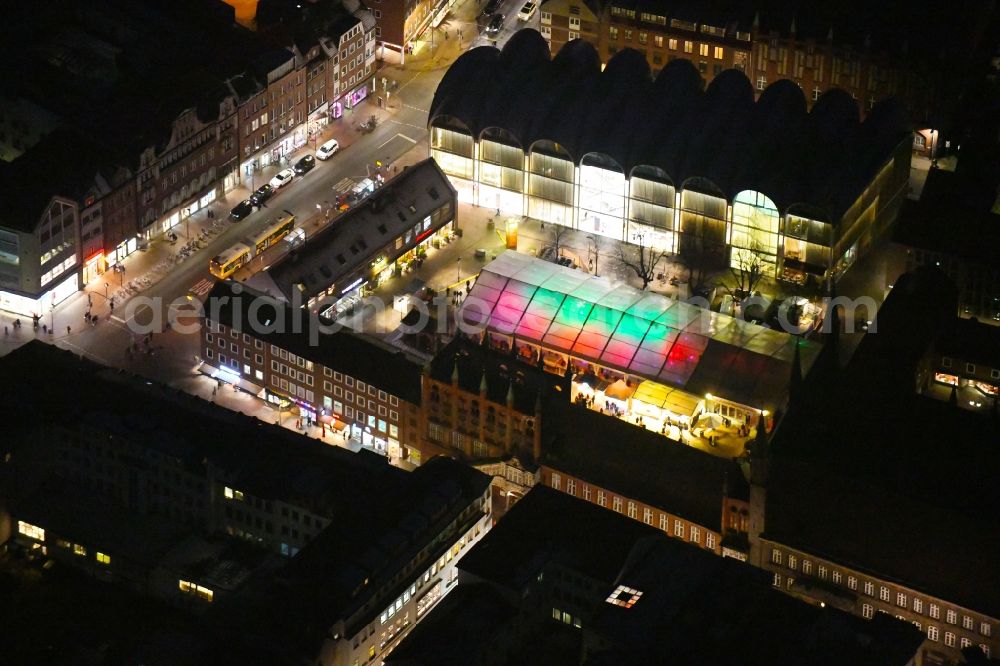 Lübeck at night from above - Night lighting tourist attraction and sightseeing Openair-Eisstadion Am Markt in the district Innenstadt in Luebeck in the state Schleswig-Holstein, Germany