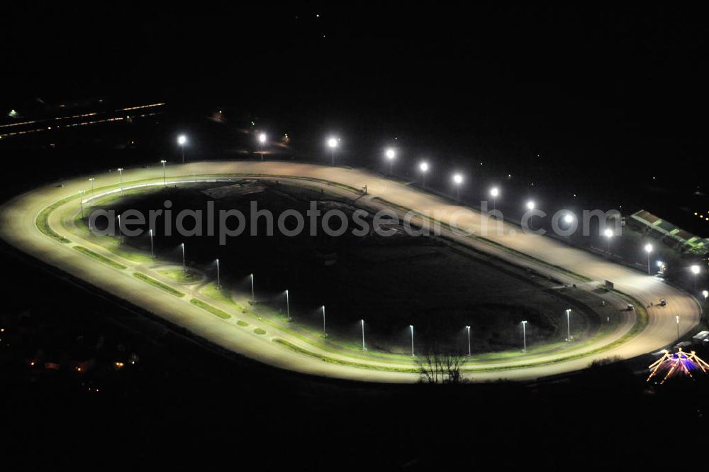 Berlin at night from the bird perspective: Nachtaufnahme der Trabrennbahn / des Pferdesportpark in Berlin Karlshorst. Night shot of the trotting course Berlin in the district of Karlshorst