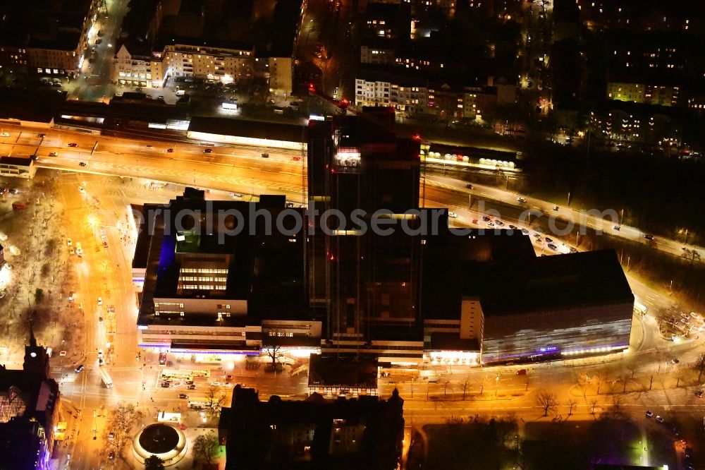 Aerial photograph at night Berlin - Night lighting highrise building of the Steglitzer Kreisel - UeBERLIN Wohntower complex on Schlossstrasse in the district of Steglitz in Berlin