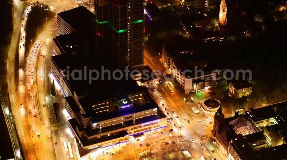 Aerial photograph at night Berlin - Night lighting highrise building of the Steglitzer Kreisel - UeBERLIN Wohntower complex on Schlossstrasse in the district of Steglitz in Berlin