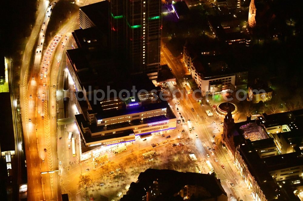 Berlin at night from above - Night lighting highrise building of the Steglitzer Kreisel - UeBERLIN Wohntower complex on Schlossstrasse in the district of Steglitz in Berlin