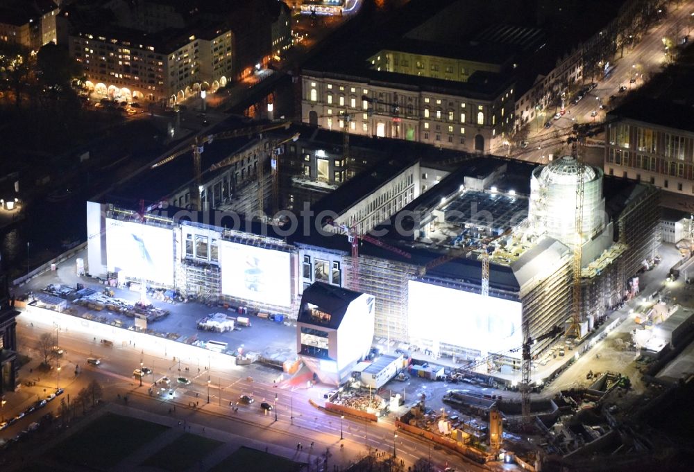 Aerial photograph at night Berlin - Night view of construction site for the new building the largest and most important cultural construction of the Federal Republic, the building of the Humboldt Forum in the form of the Berlin Palace