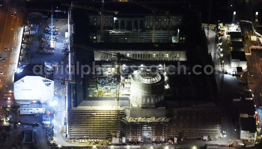 Berlin at night from above - Night view of construction site for the new building the largest and most important cultural construction of the Federal Republic, the building of the Humboldt Forum in the form of the Berlin Palace